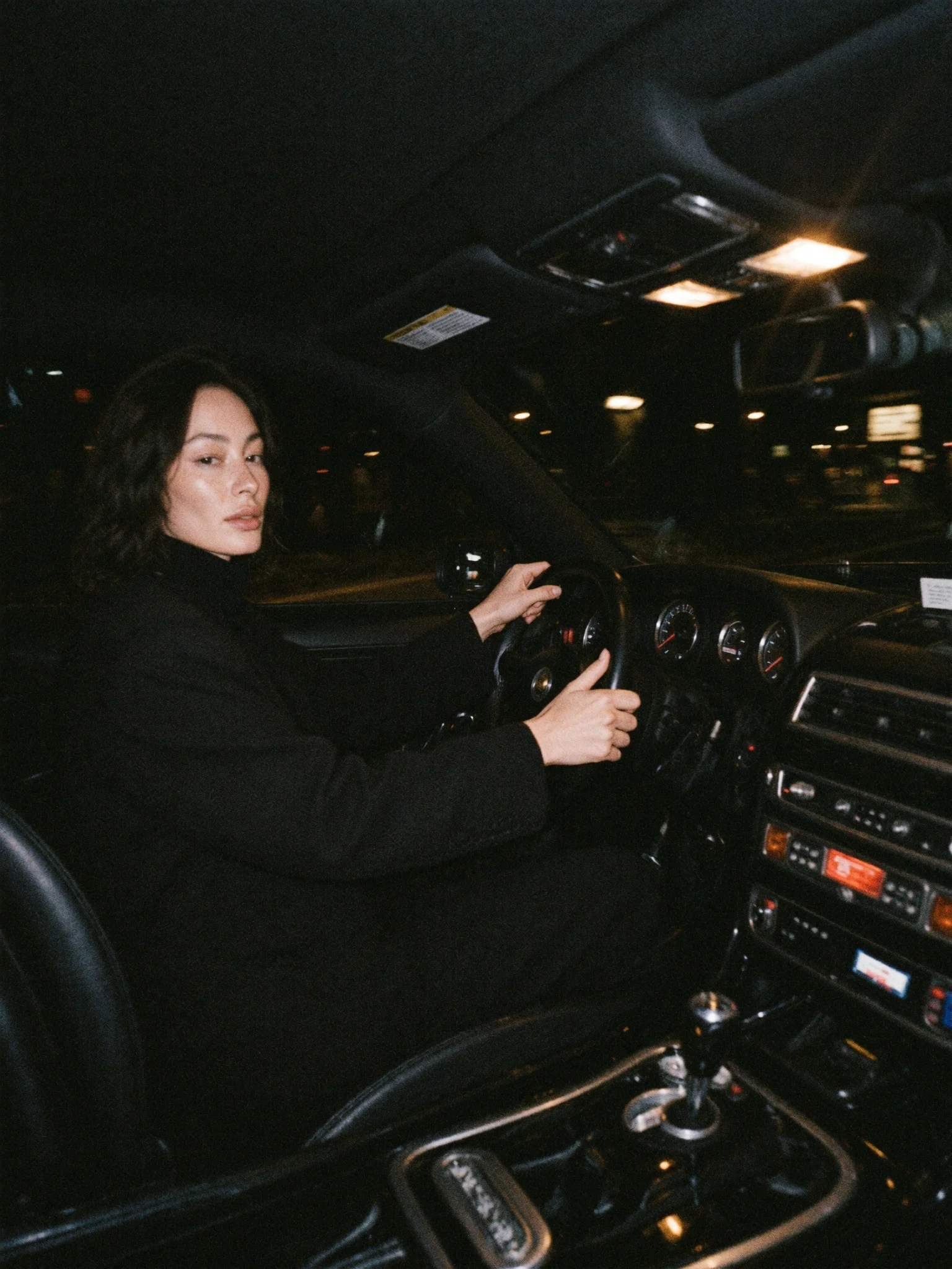 Moody nighttime car interior aesthetic prompt